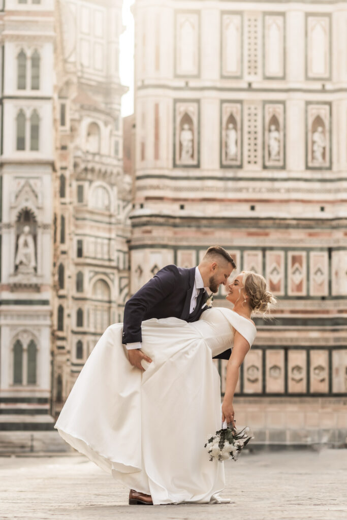 Italy elopement photographer capturing a couple eloping in front of the dome of Florence at sunrise.