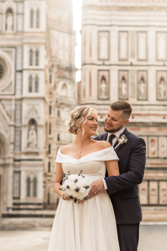 Italy elopement photographer capturing a couple eloping in front of the dome of Florence at sunrise.