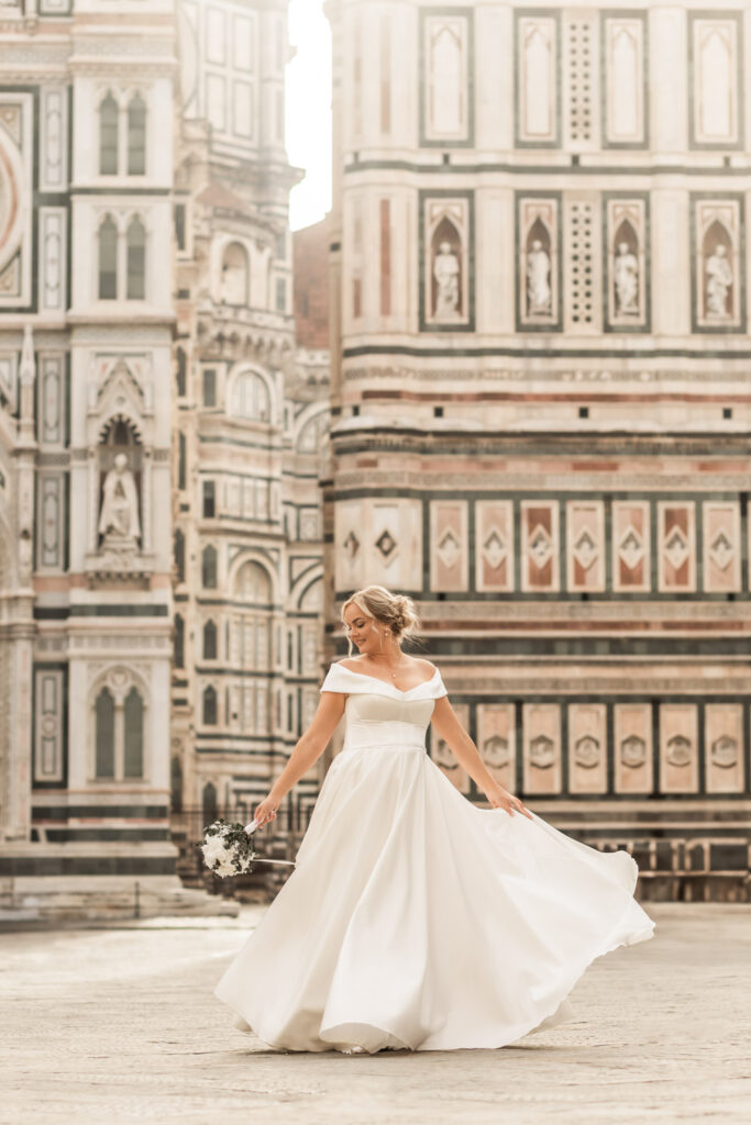 Italy elopement photographer capturing a couple eloping in front of the dome of Florence at sunrise.