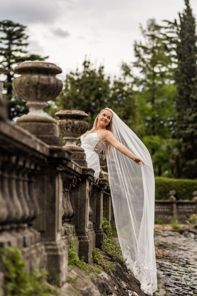 bridal portrait on an old stone bridge in lake garda
