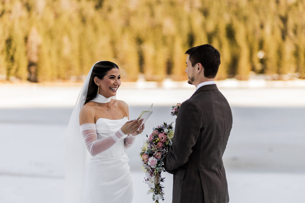 candid elopement ceremony moments surrounded by mountain views in the Dolomites
