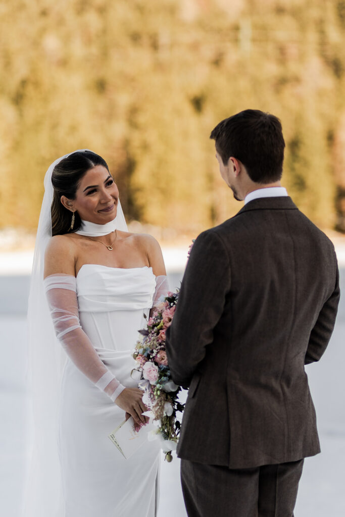 candid elopement ceremony moments surrounded by mountain views in the Dolomites