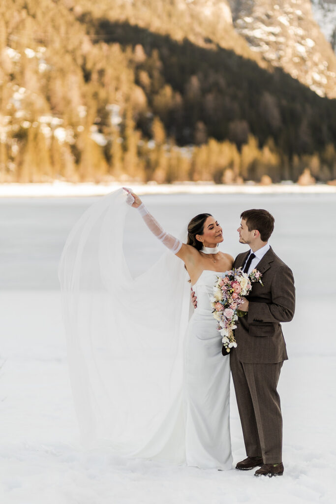 candid elopement ceremony moments surrounded by mountain views in the Dolomites