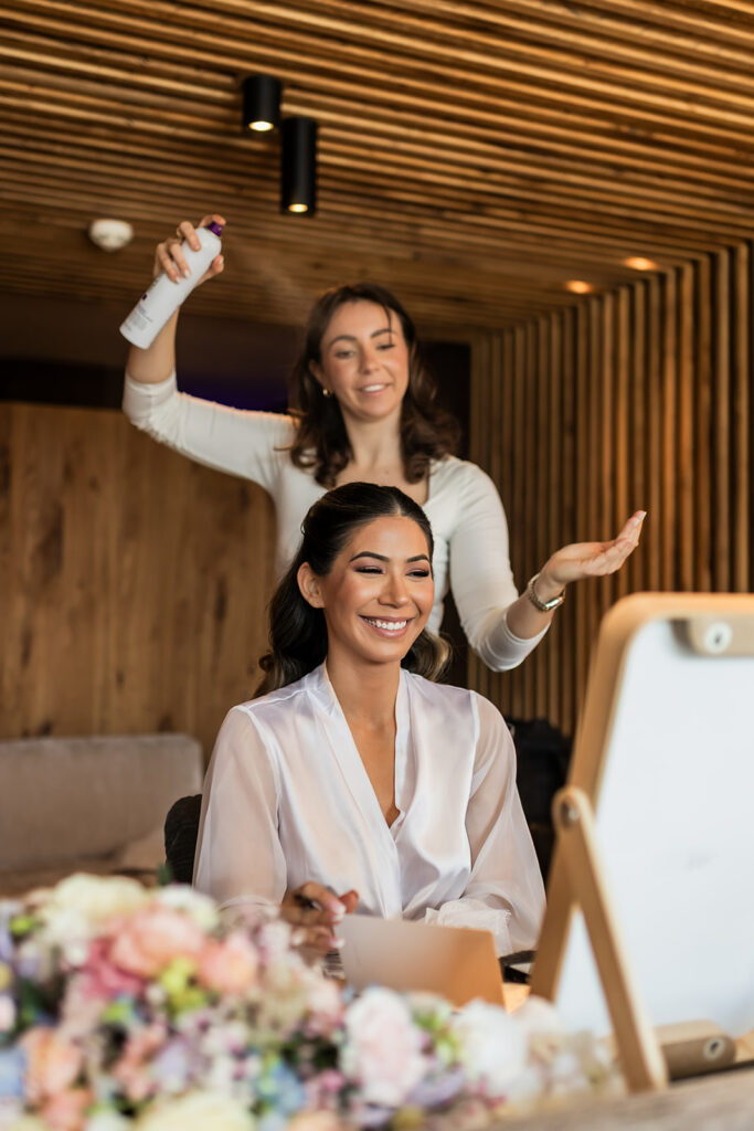bride getting her hair done before their dolomites elopement day