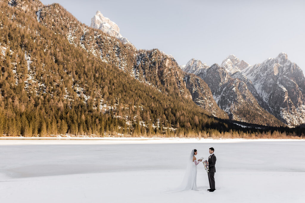 candid elopement ceremony moments surrounded by mountain views in the Dolomites