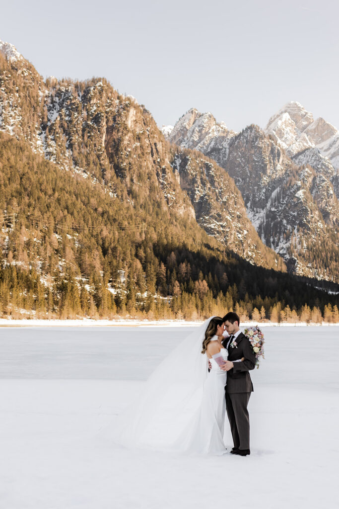 candid elopement ceremony moments surrounded by mountain views in the Dolomites