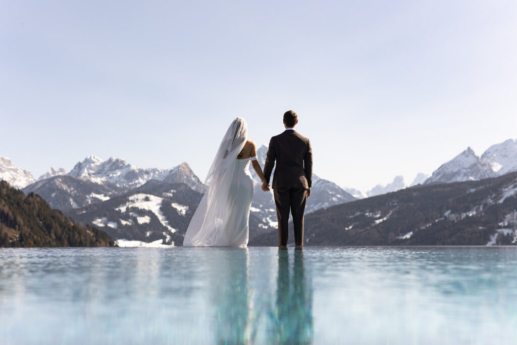 bride and groom infinity pool photos