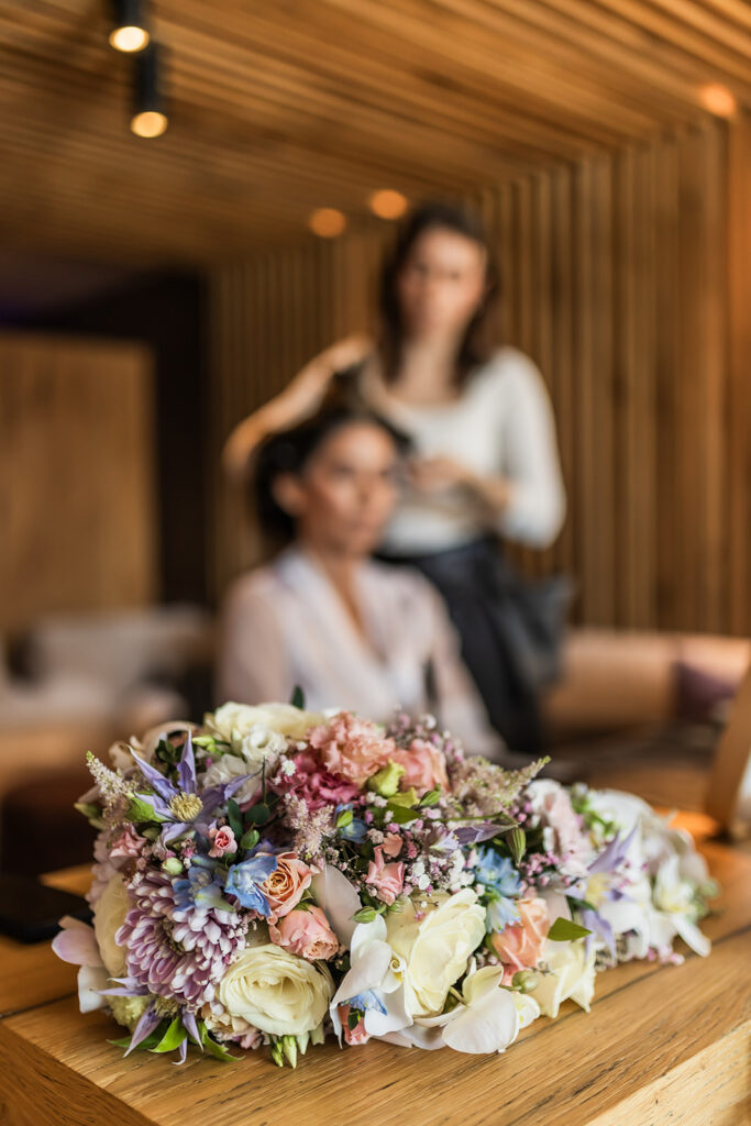 bride getting her hair done before their dolomites elopement day