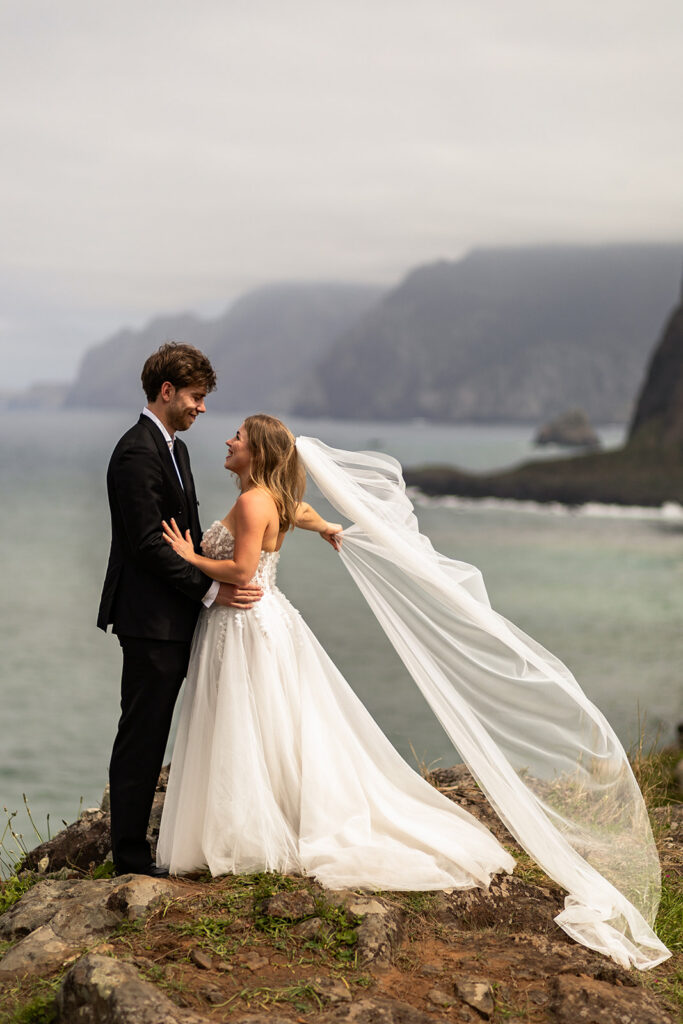 bride and groom holding each other during madeira elopement