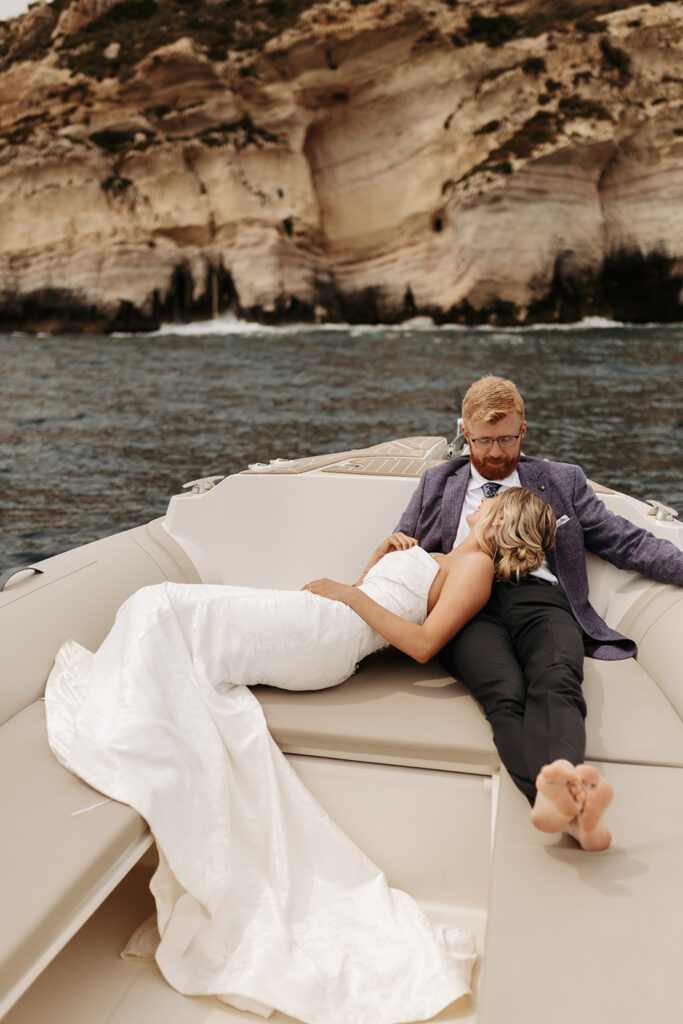 adventurous elopement couple enjoying a boat ride during their sardinia elopement