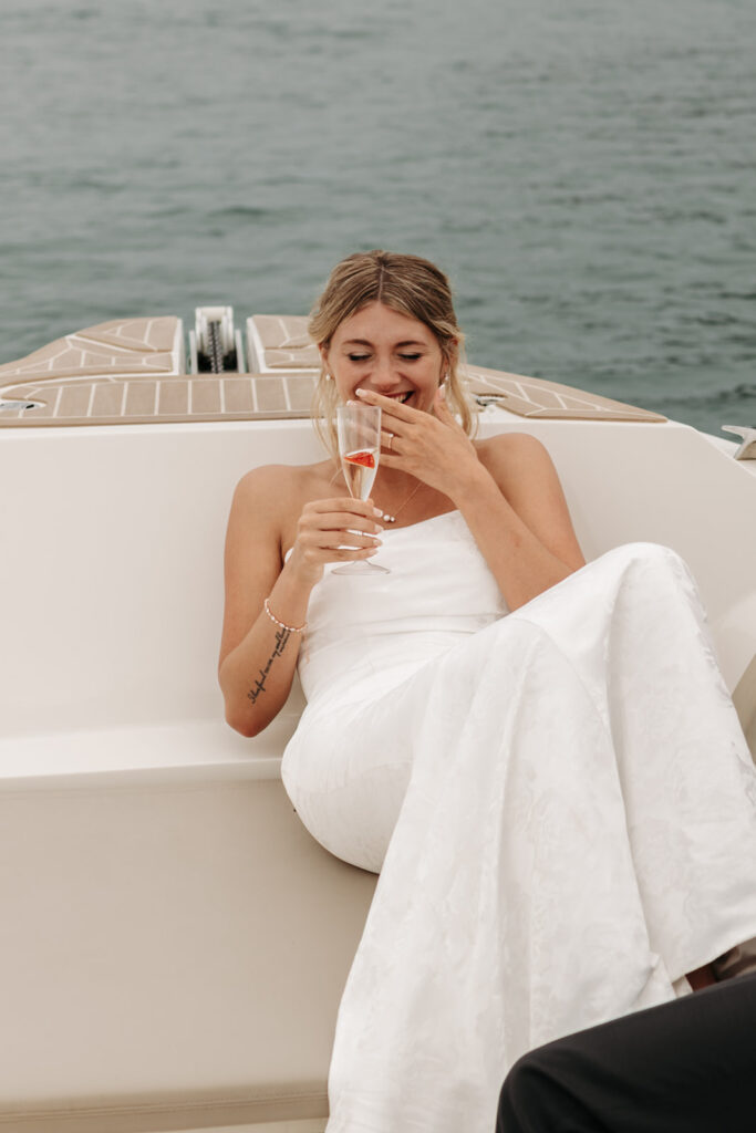 playful couple's moments on a boat during a sardinia elopement