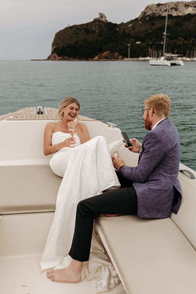 playful couple's moments on a boat during a sardinia elopement