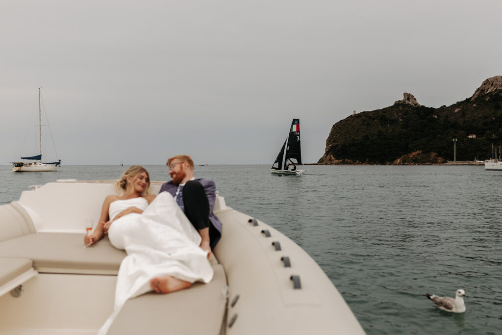 adventurous elopement couple enjoying a boat ride during their sardinia elopement