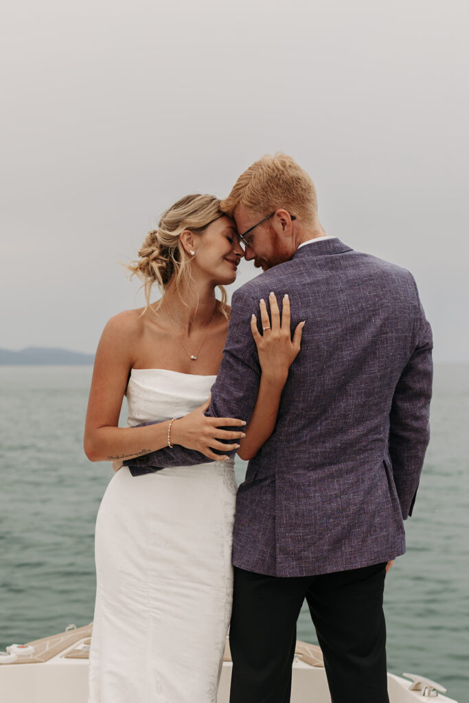 playful bride and groom moments on the boat during their sardinia elopement