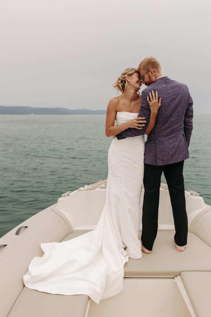 elopement couple posing on a boat during their sardinia elopement