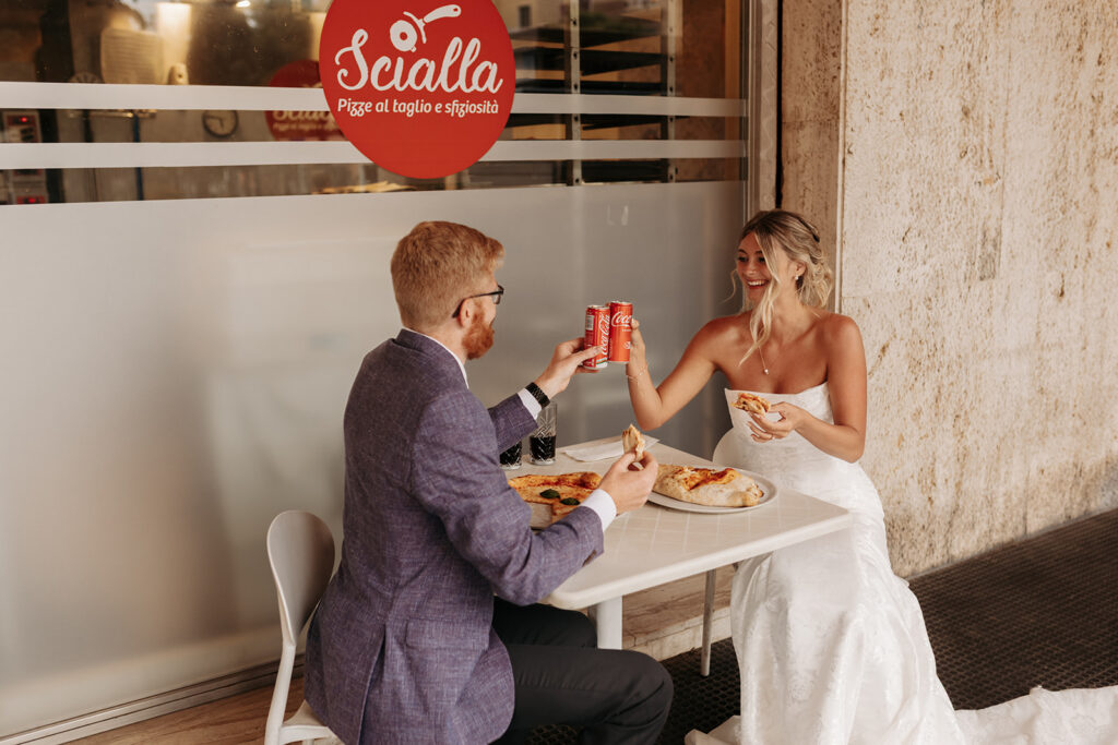 bride and groom enjoying a pizza break in cagliari during their sardinia elopement