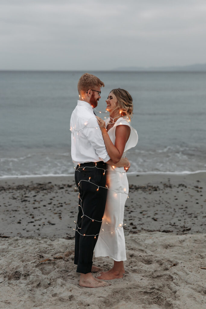 bride and groom in twinkly lights