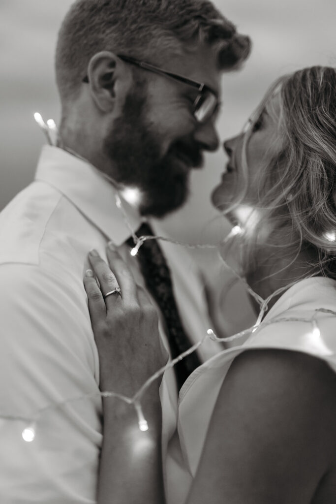 bride and groom in twinkly lights