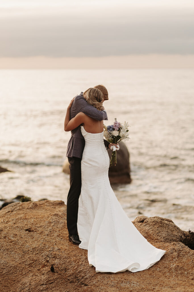 candid bride and groom elopement first look on a cliff in sardinia