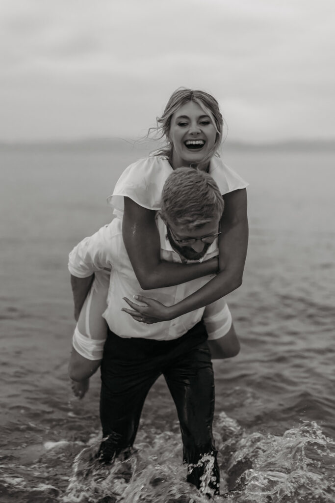 bride and groom being playful in the water during their elopement in sardinia