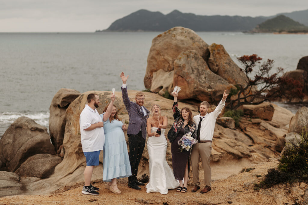 fun elopement couple with family 