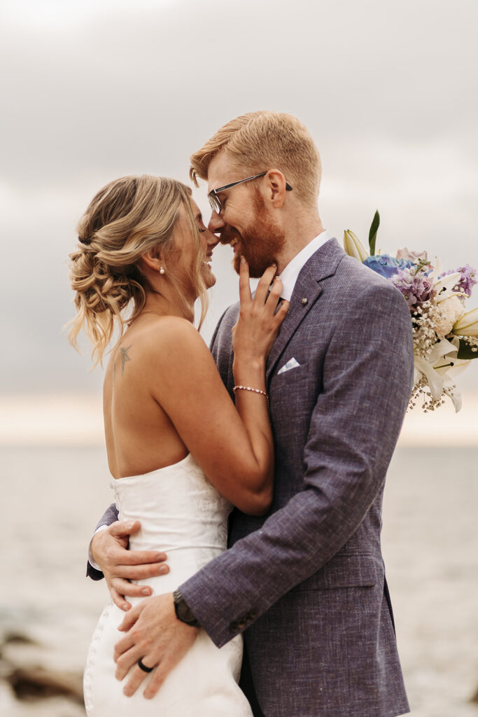 sweet elopement couple on a small cliff during their sardinia elopement