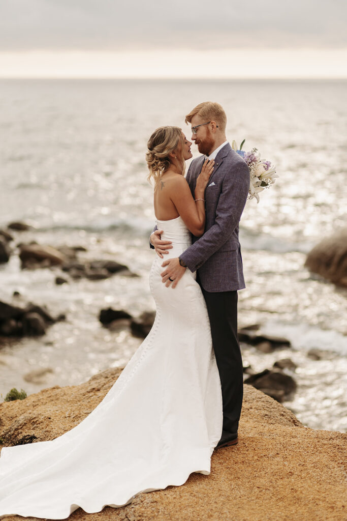sweet elopement couple on a small cliff during their sardinia elopement
