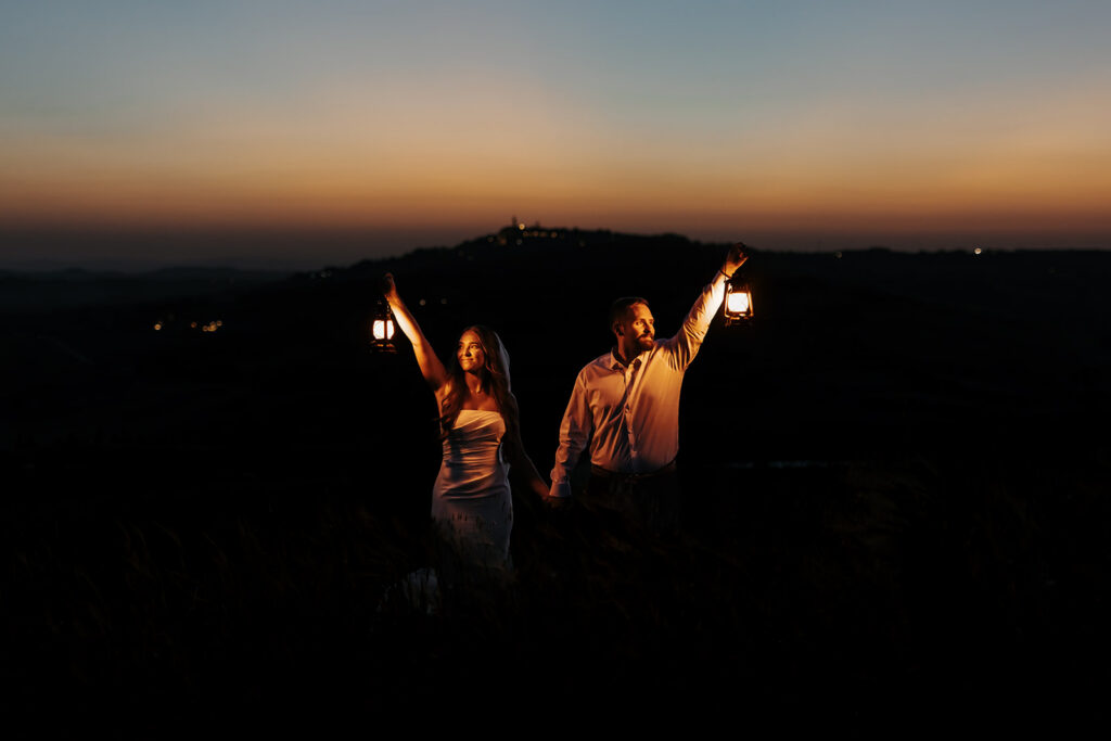 nighttime elopement moments with the couple holding lanterns