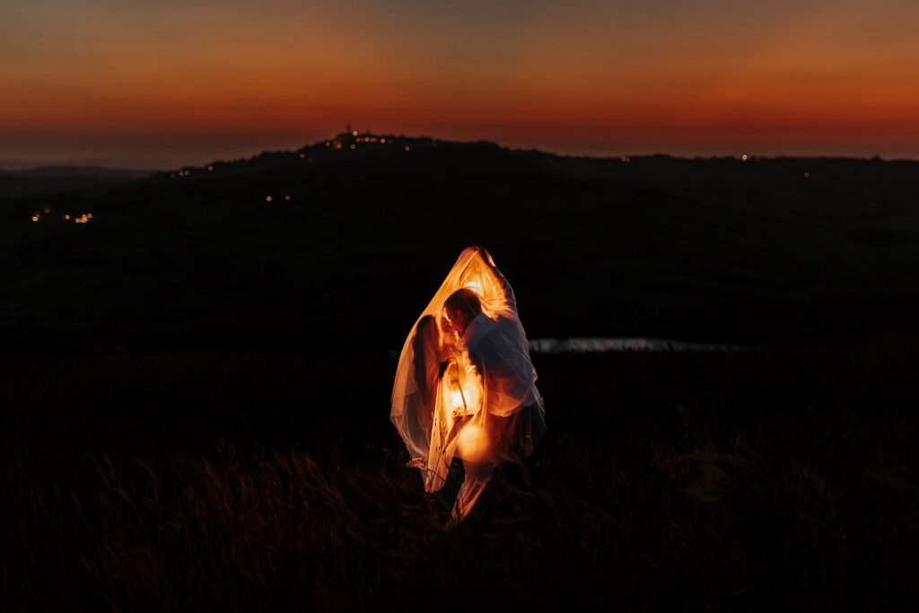 nighttime elopement moments with the couple holding lanterns