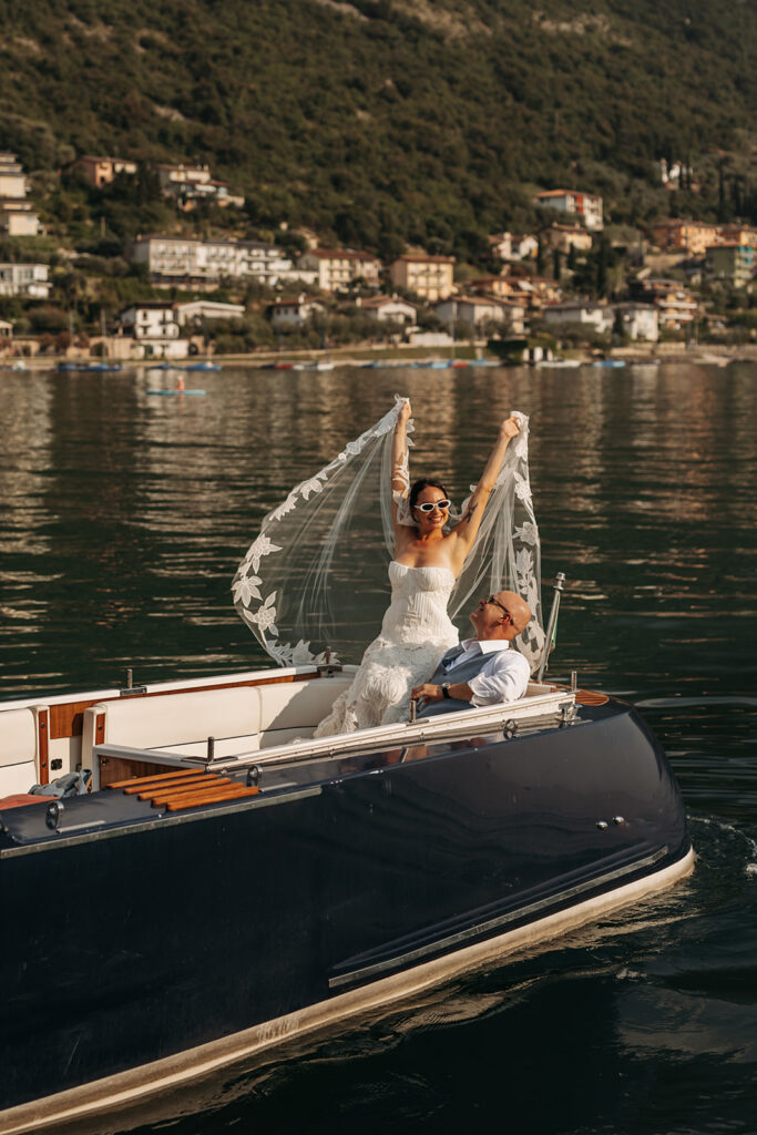 elopement couple enjoying a scenic boat ride in italy