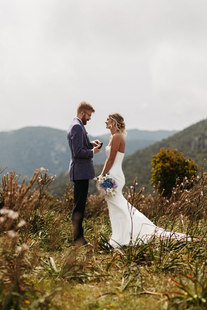 playful elopement couple in a wildflower field during their multi day elopement in sardinia
